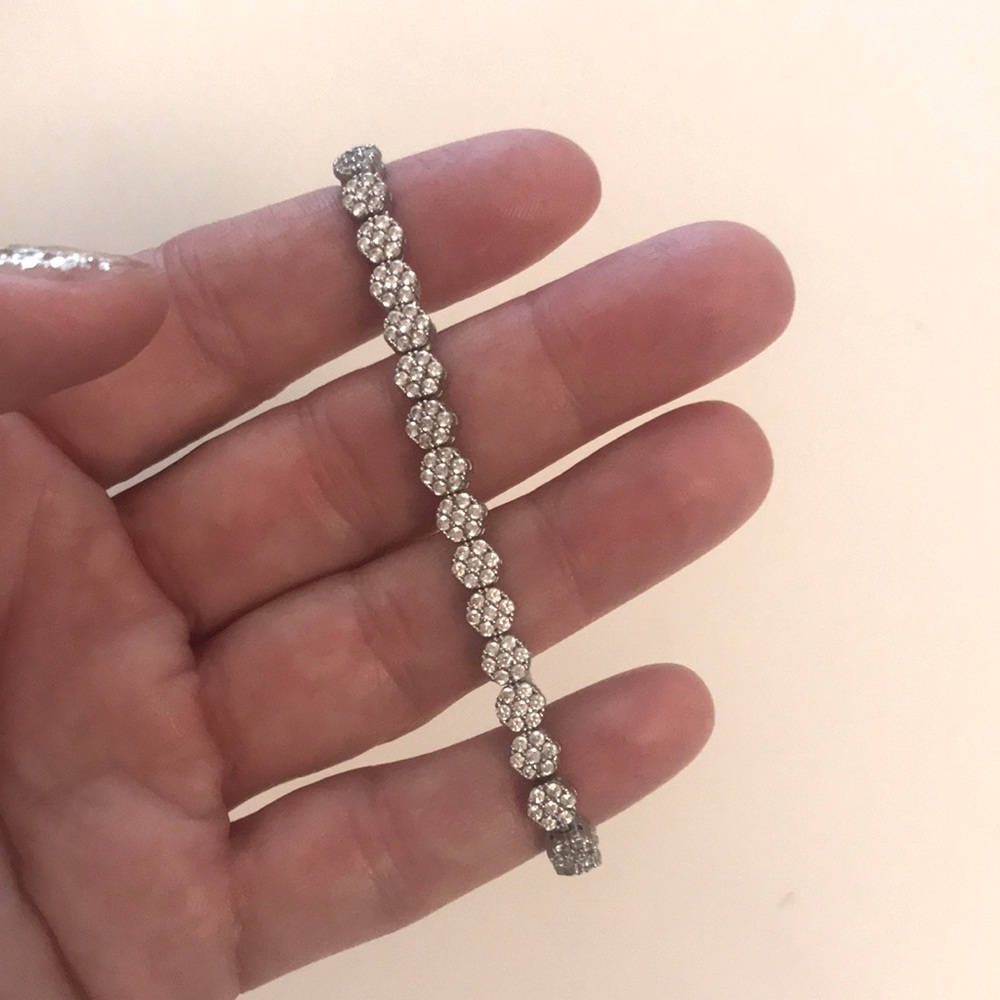 Silver plated Tennis bracelet-like, never worn. Perfect for stacking.